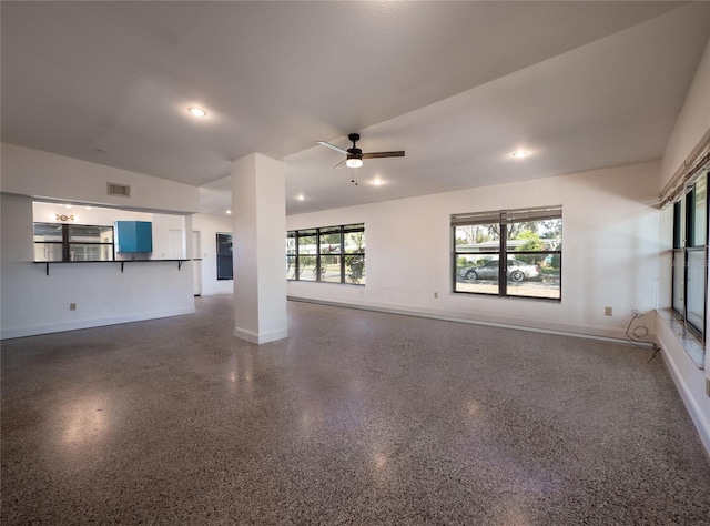 unfurnished living room with ceiling fan