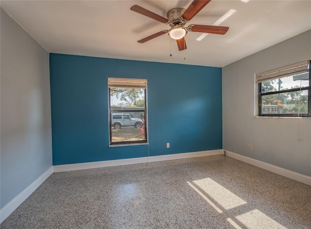 unfurnished room with ceiling fan