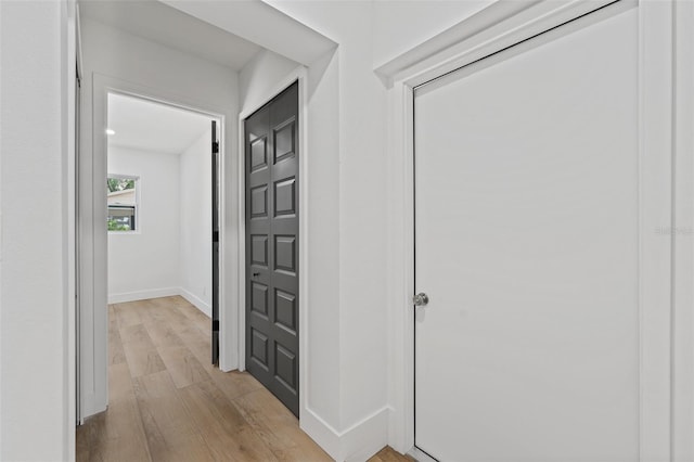 corridor featuring light hardwood / wood-style flooring