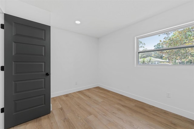 spare room with light hardwood / wood-style floors