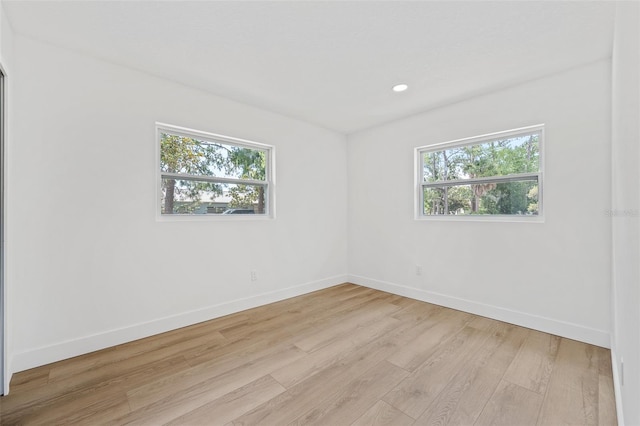 spare room featuring light wood-type flooring