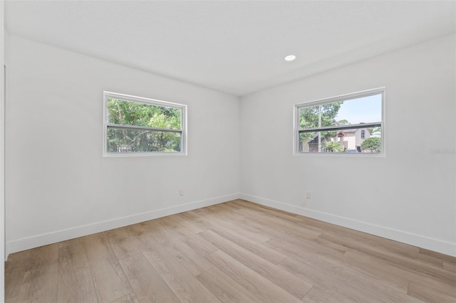 unfurnished room featuring light hardwood / wood-style floors