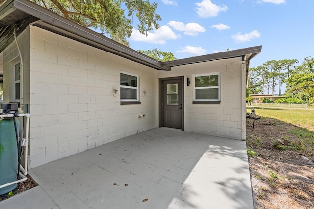 entrance to property with a patio area