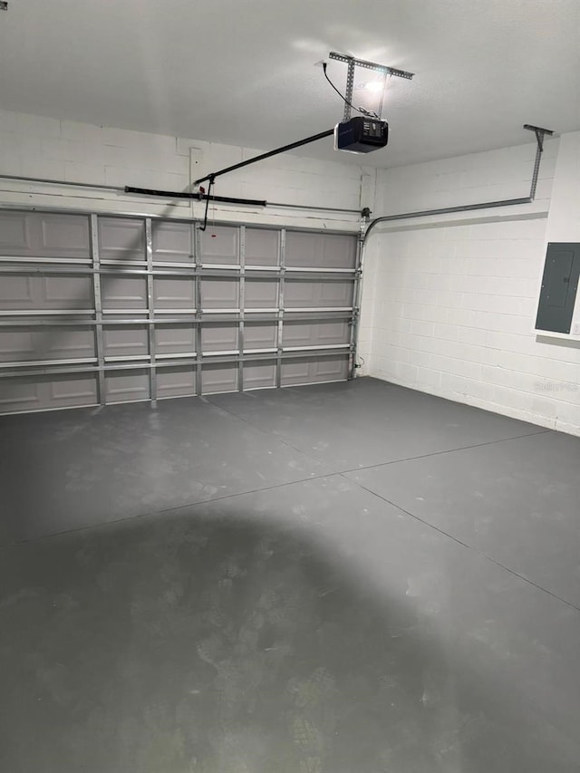 garage featuring a garage door opener and electric panel