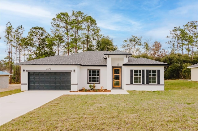 view of front of house with a garage and a front yard