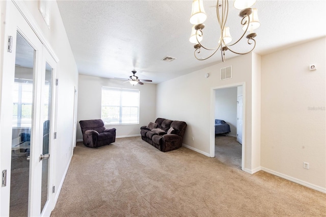 1351 Venezia Ct Unit 304, Davenport, FL 33896 - living area with visible vents, carpet, and a textured ceiling