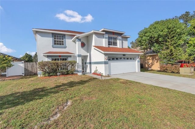 view of front of home featuring a front yard and a garage