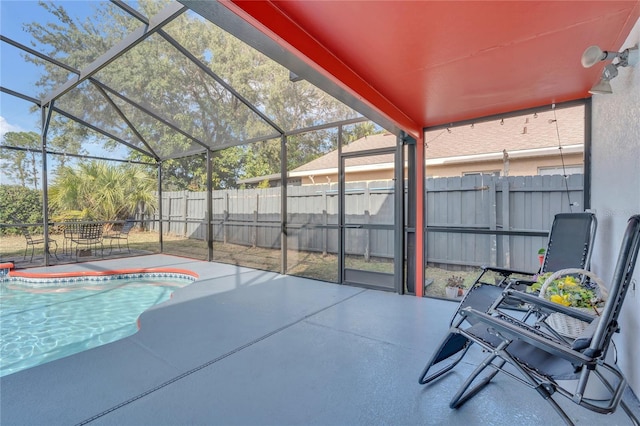 exterior space featuring glass enclosure and a patio area