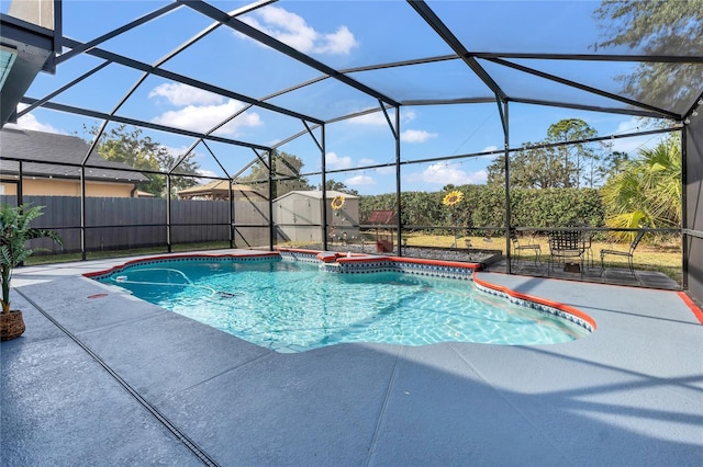 view of pool with a lanai and a patio