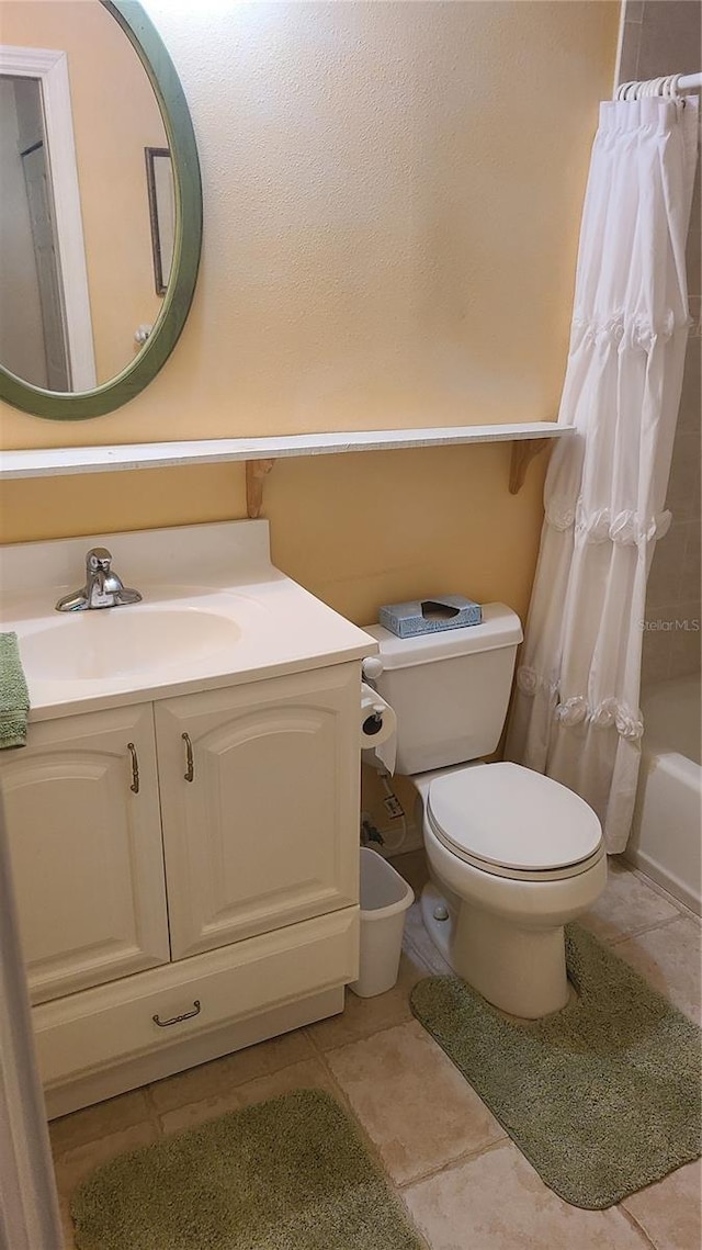 full bathroom with shower / tub combo, vanity, and toilet