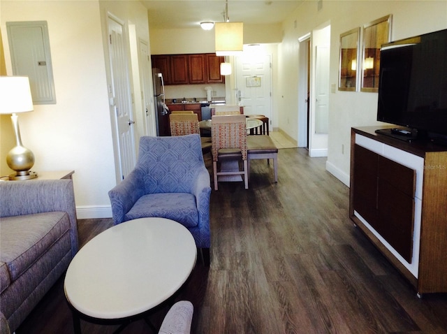 living room featuring electric panel and dark hardwood / wood-style floors