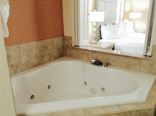 bathroom with tiled bath