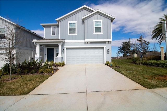 view of front of house with a front lawn and a garage