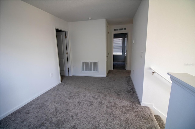 empty room featuring light carpet