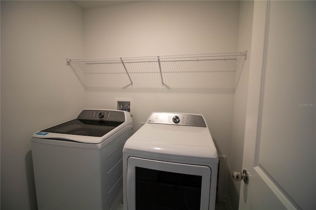 laundry area with washing machine and dryer