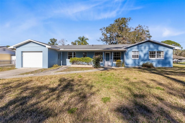 single story home with a front yard and a garage