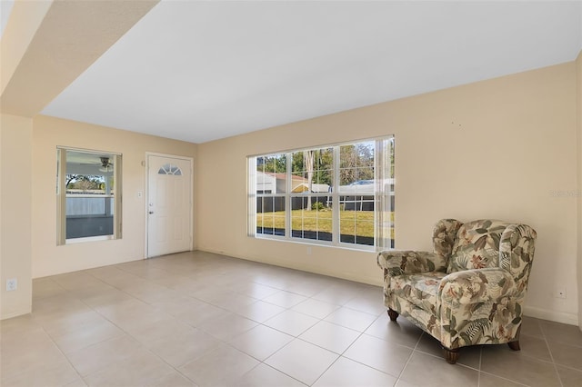 living area with light tile patterned floors and plenty of natural light