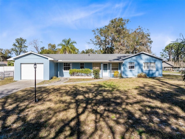 ranch-style house with a front lawn and a garage