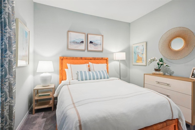 bedroom with dark colored carpet