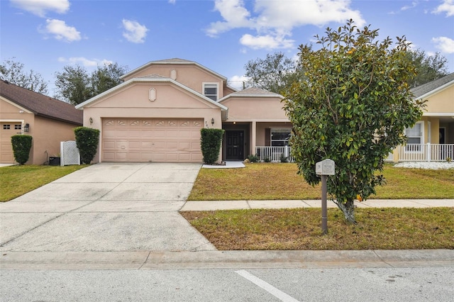 view of front of home with a front lawn, a garage, and a porch