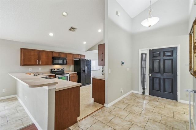 kitchen with black appliances, decorative light fixtures, sink, kitchen peninsula, and light tile patterned floors