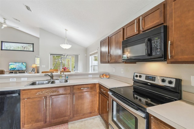 kitchen with black appliances, sink, hanging light fixtures, and lofted ceiling