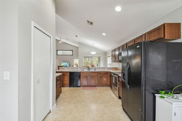 kitchen with kitchen peninsula, ceiling fan, vaulted ceiling, black appliances, and sink