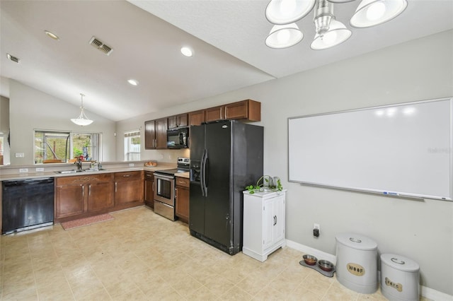 kitchen featuring vaulted ceiling, black appliances, sink, hanging light fixtures, and a chandelier