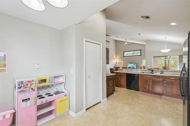 kitchen with ceiling fan, vaulted ceiling, pendant lighting, black appliances, and sink