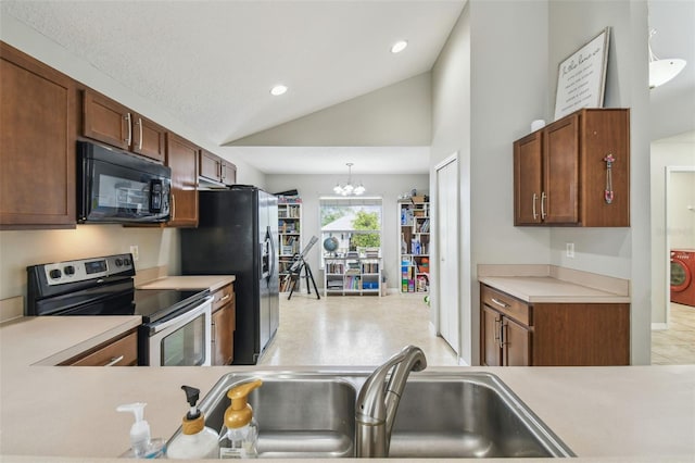 kitchen with lofted ceiling, pendant lighting, black appliances, sink, and a chandelier