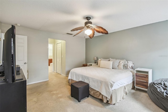 bedroom with ceiling fan and a textured ceiling