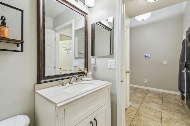 bathroom with vanity and tile patterned flooring