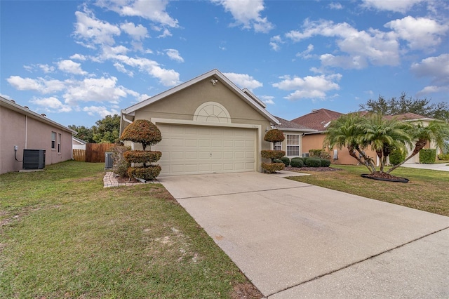 view of front of home with a front yard, a garage, and central AC unit