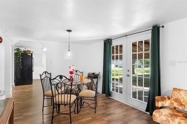 dining room featuring dark hardwood / wood-style flooring and french doors