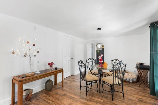 dining space featuring dark hardwood / wood-style floors