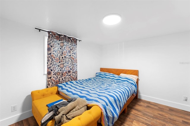 bedroom featuring dark wood-type flooring