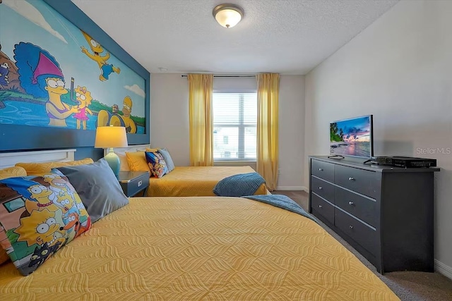 carpeted bedroom featuring a textured ceiling