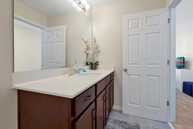 bathroom with tile patterned flooring and vanity