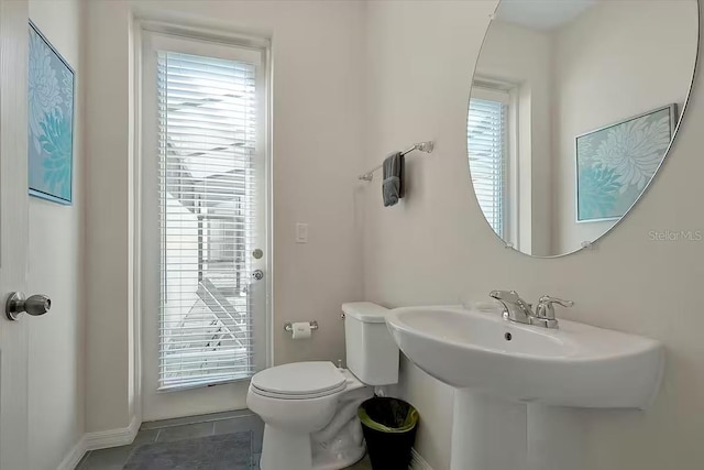 bathroom featuring tile patterned floors and toilet