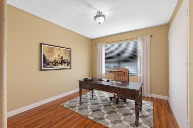 office featuring a textured ceiling and hardwood / wood-style flooring