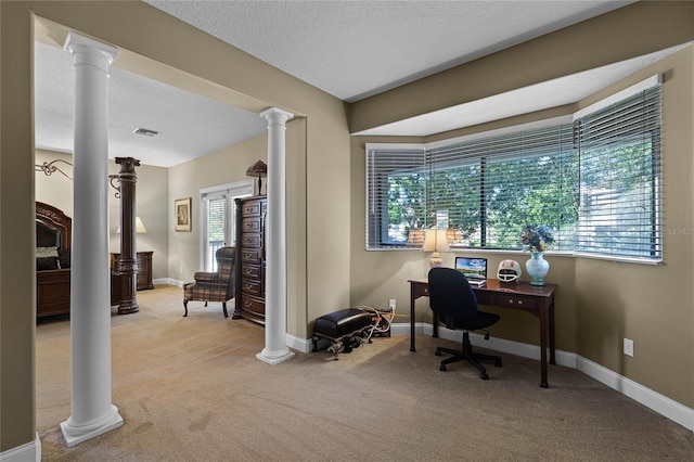 office space featuring a textured ceiling and light carpet