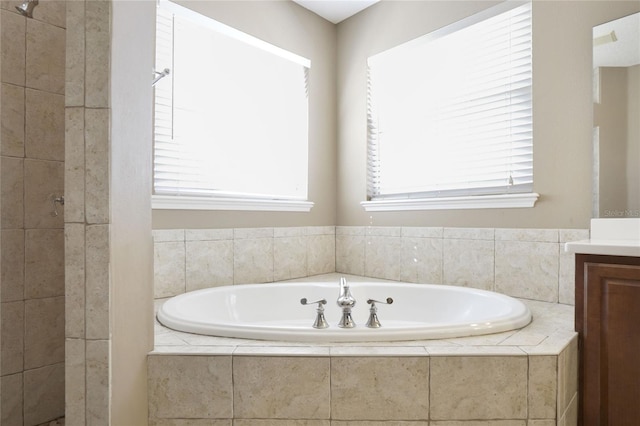 bathroom with vanity and independent shower and bath