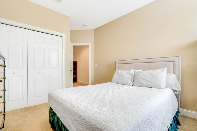 carpeted bedroom featuring a closet