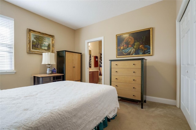 bedroom with ensuite bath, light carpet, a closet, and multiple windows