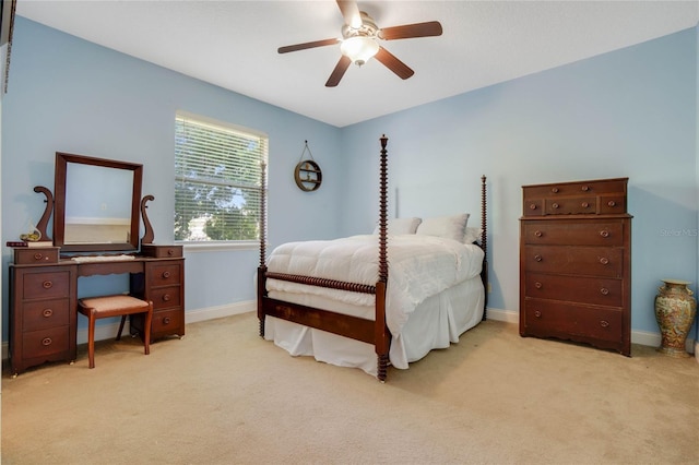 bedroom with ceiling fan and light carpet