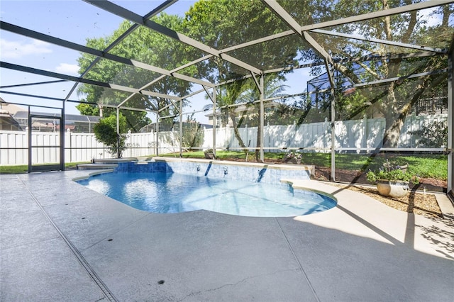 view of pool with a patio and a lanai