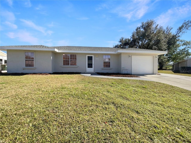 ranch-style home featuring a garage and a front lawn