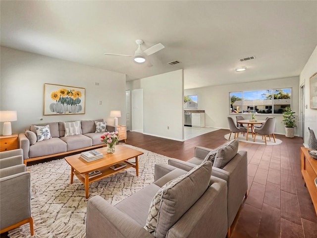 living room featuring hardwood / wood-style flooring and ceiling fan