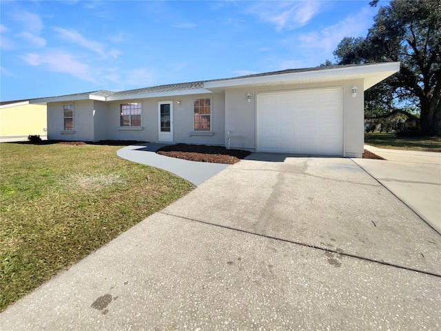 ranch-style house with a garage and a front lawn