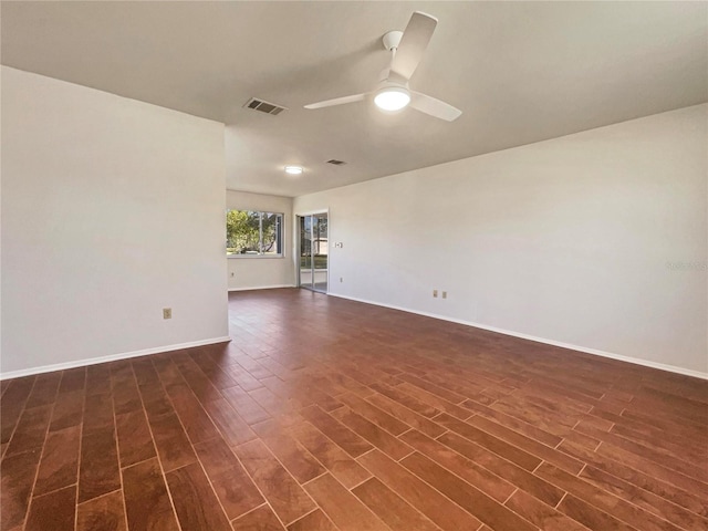 unfurnished room featuring dark hardwood / wood-style floors and ceiling fan